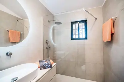 a bathroom with a shower and a sink at Villa Silveira in Vilamoura