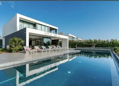 a house with a swimming pool next to a house at Villa Algarve Paradise in Vilamoura