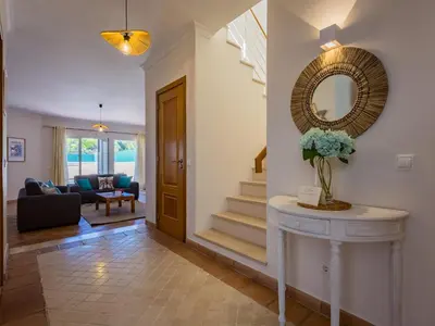 a living room with two couches and a tv at Pine Haven in Faro
