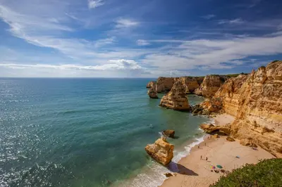 a view of a beach with rocks in the ocean at Oleander Terrace Albufeira in Faro