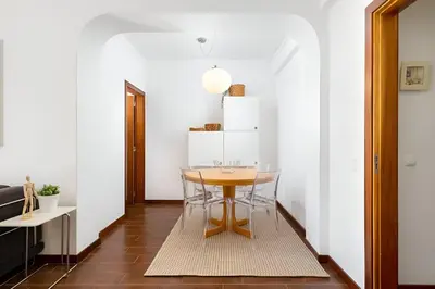 a small dining room with a table and chairs at Sal da Viana, Modern Ground Floor, Vilamoura in Vilamoura