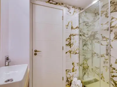 a bathroom with a shower and a sink at AL - Vilamoura Top Floor in Vilamoura