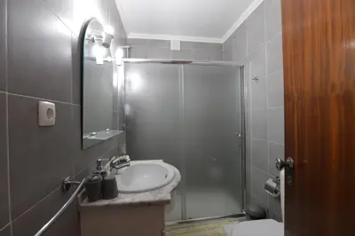 a bathroom with a shower and a sink at Apartamento Brisa Mar in Albufeira