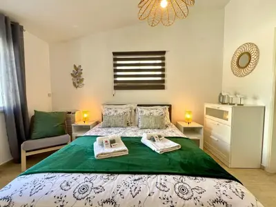 a bedroom with a bed with two towels on it at Vilamoura Brightness Villa With Pool by Homing in Vilamoura