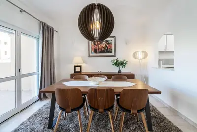 a dining room with a table and chairs at Villa Verde by IntiHolidays in Guia