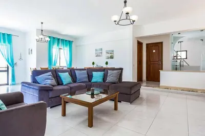 a living room with a couch and a coffee table at Villa Bonita Gale in Galé