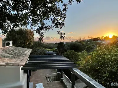 a set of stairs with the sunset in the background at The Quinta Retreat Algarve Available to Facilitators yoga & sound therapies, massage mindfulness in Almancil