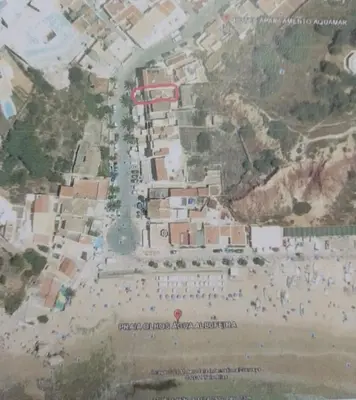 a map of a beach with people on the sand at BEACH HOUSE in Olhos de Água