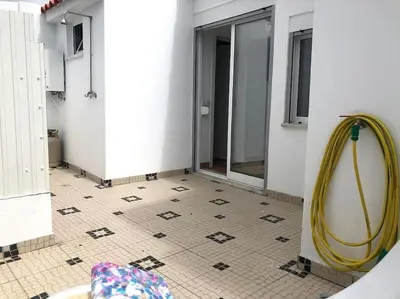 a bathroom with a hose attached to a wall at Casa Vitoria - Olhos de Agua - Albufeira in Roja- Pé