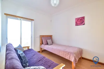 a small room with two beds and a closet at Vila Alfarrobeira by MTPhomes in Albufeira