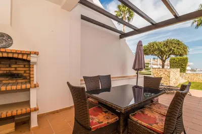 a dining room with a table and chairs at Apartamento albufeira cerro da águia in Albufeira