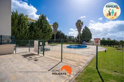 a batting cage in a park with a playground at #201 Families Only - Quinta da Flor in Albufeira