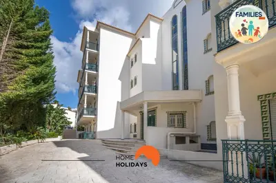 a building with a sign that reads familles home holidays at #201 Families Only - Quinta da Flor in Albufeira