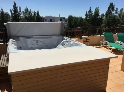 a hot tub sitting on top of a roof at Apartment Rosmaninho-Hosted by Sweetstay in Quarteira