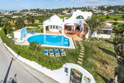 an aerial view of a house with a swimming pool at Villa Gira in Albufeira