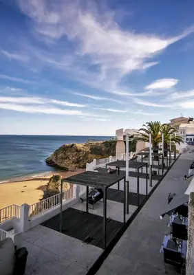 a view of the beach from the balcony of a resort at Algarvian Experience - Sun, Beach and Pool in Albufeira