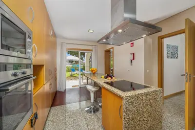 a kitchen with a island with a counter top at Meadow View Retreat in Albufeira