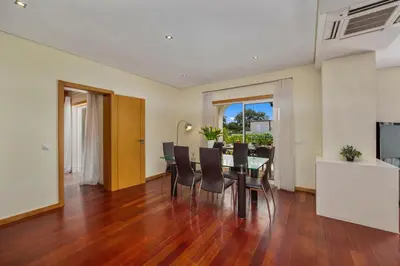 a dining room with a table and chairs at Meadow View Retreat in Albufeira