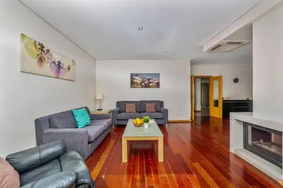 a living room with a couch and a table at Meadow View Retreat in Albufeira
