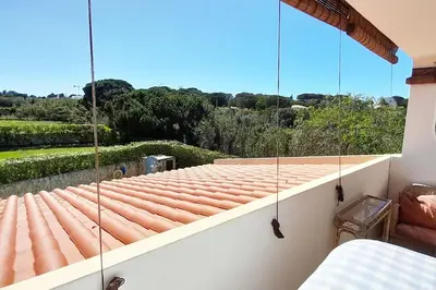 a balcony with a roof with a view at Villa Mirasol - Relaxed Private Villa in Albufeira