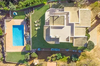 an aerial view of a house with a swimming pool at Villa Gabie in Albufeira
