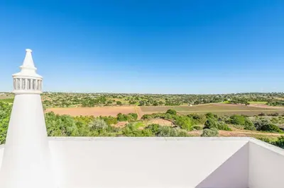 a white lighthouse sitting on top of a white wall at Villa Gabie in Albufeira