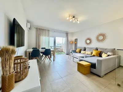 a living room with a couch and a table at Why Knot Beach, Marina Nearby in Quarteira