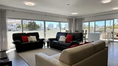 a living room with a couch and two chairs at Harmony by Check-in Portugal in Albufeira