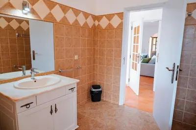 a bathroom with a sink and a mirror at Villa Miracampo - Elegant Secret in Albufeira
