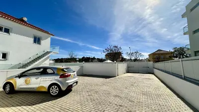 a small car parked in front of a house at Hibisco 2 by Check-in Portugal in Albufeira