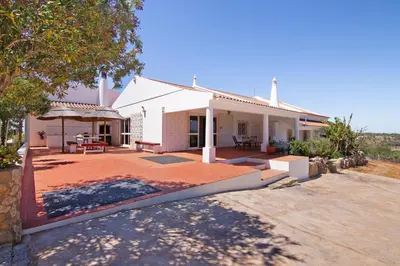 a house with a large patio in front of it at Monte do Pataco in Albufeira