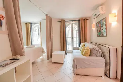 a living room with a couch and a table at Old Village Vilamoura in Quarteira