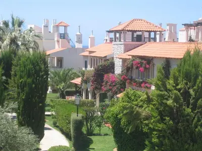 a view of a house with plants and trees at Old Village Vilamoura in Quarteira