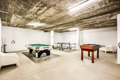 a room with two ping pong tables in it at Villa Aventura in Albufeira