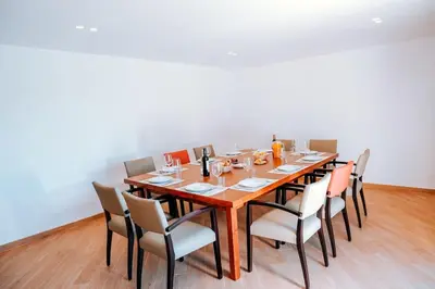 a dining room with a long wooden table and chairs at Villa Coelha - Algarve's Pearl in Albufeira