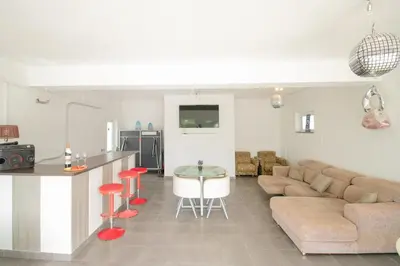 a living room with a couch and a table at Villa dos Sonhos - Wide Dreams in Albufeira
