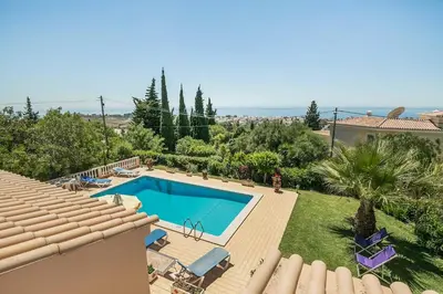 a swimming pool in the backyard of a house at Villa Cerrinho in Albufeira