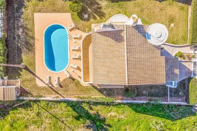 a bedroom with two beds and a window at Villa Natalia Sun in Albufeira