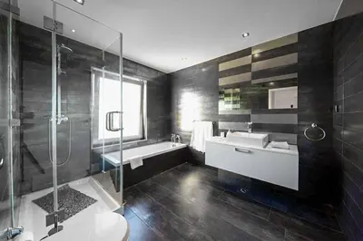 a bathroom with a tub and a sink and a shower at Villa Dala in Albufeira