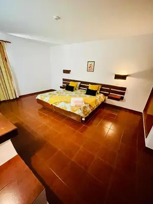 a bedroom with a large bed in a room at Resort Albufeira T1, Praia da Oura in Albufeira