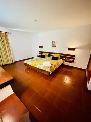 a bedroom with a large bed in a room at Resort Albufeira T1, Praia da Oura in Albufeira