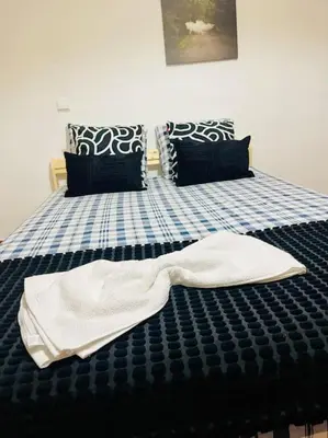 a pair of towels are laying on a bed at Resort Albufeira T1, Praia da Oura in Albufeira