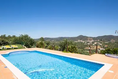 a swimming pool with a view of the mountains at Casa Salir in Salir