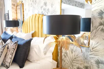 a living room with a white couch and two lamps at Seaside Serenity Villa in Albufeira