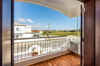 a balcony with a view of a city at Villa Canto in Albufeira