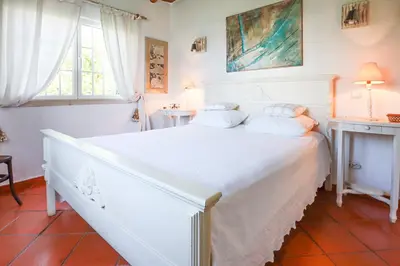 a white bedroom with a white bed and a window at Villa Vale de Ursa - 16 - BY BEDZY in Sesmarias