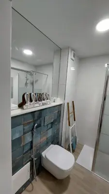a bathroom with a toilet and a sink at NORA Studio in Quarteira