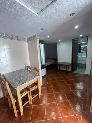 a room with a table and chairs and a tiled floor at TAC - Açoteias Budget Studio in Olhos de Água