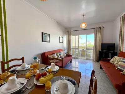 a living room with a table with fruit on it at Albufeira Concept 2 With Pool by Homing in Galé