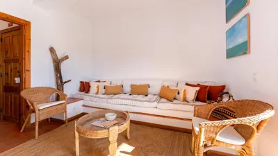 a living room with a couch and a table at Comfy 2 BDR Apartment W/ Balcony by LovelyStay in Albufeira
